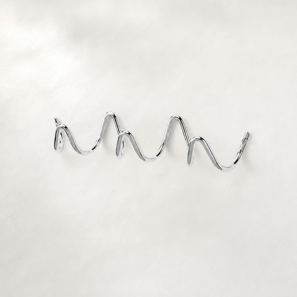Shiny chrome wavy wall-mounted multi-hook rack on a clean light background.