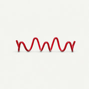 Red wavy elastic cord with small metal eyelets at both ends on a plain light background.