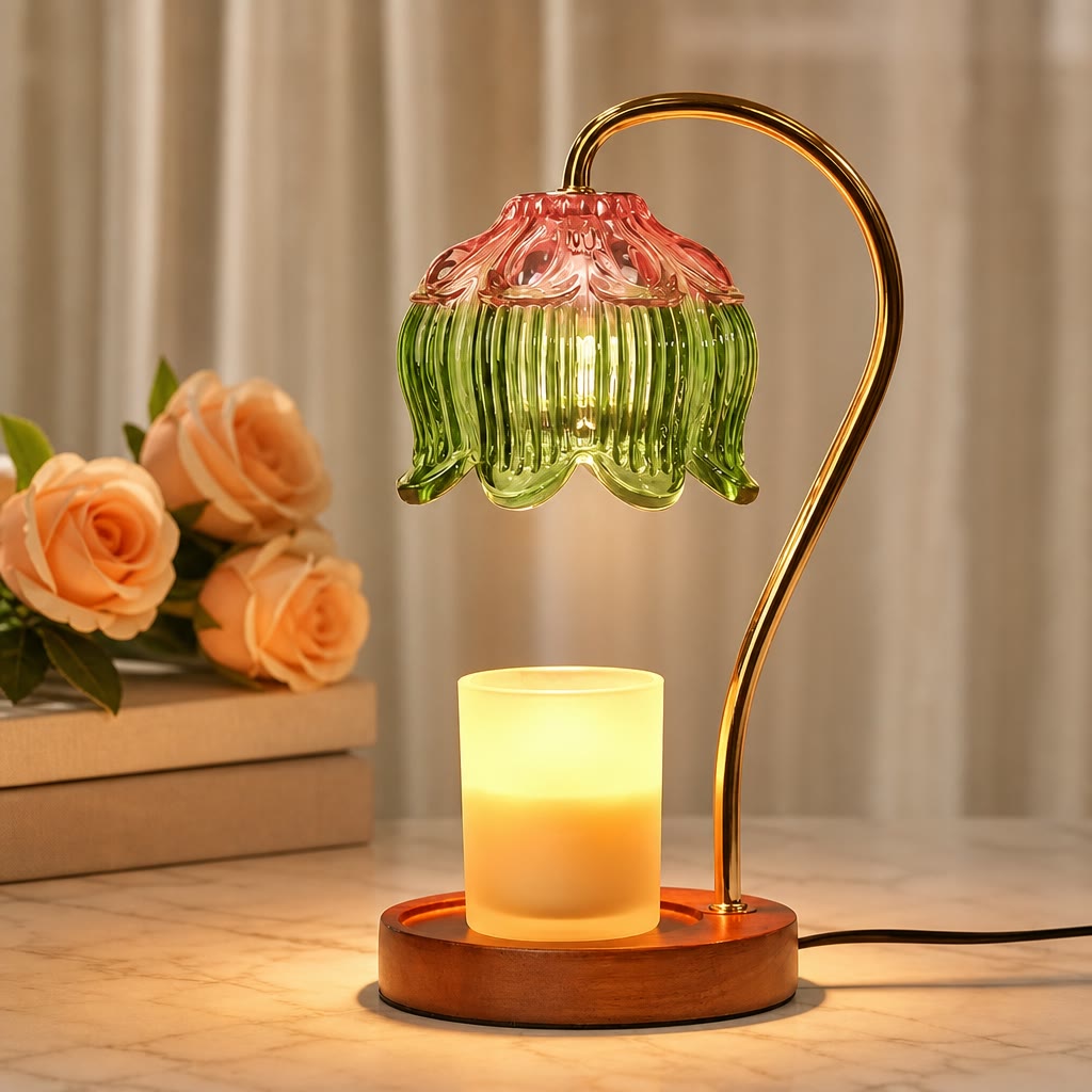 Glowing candle warmer lamp with green and pink glass shade on a wooden base.