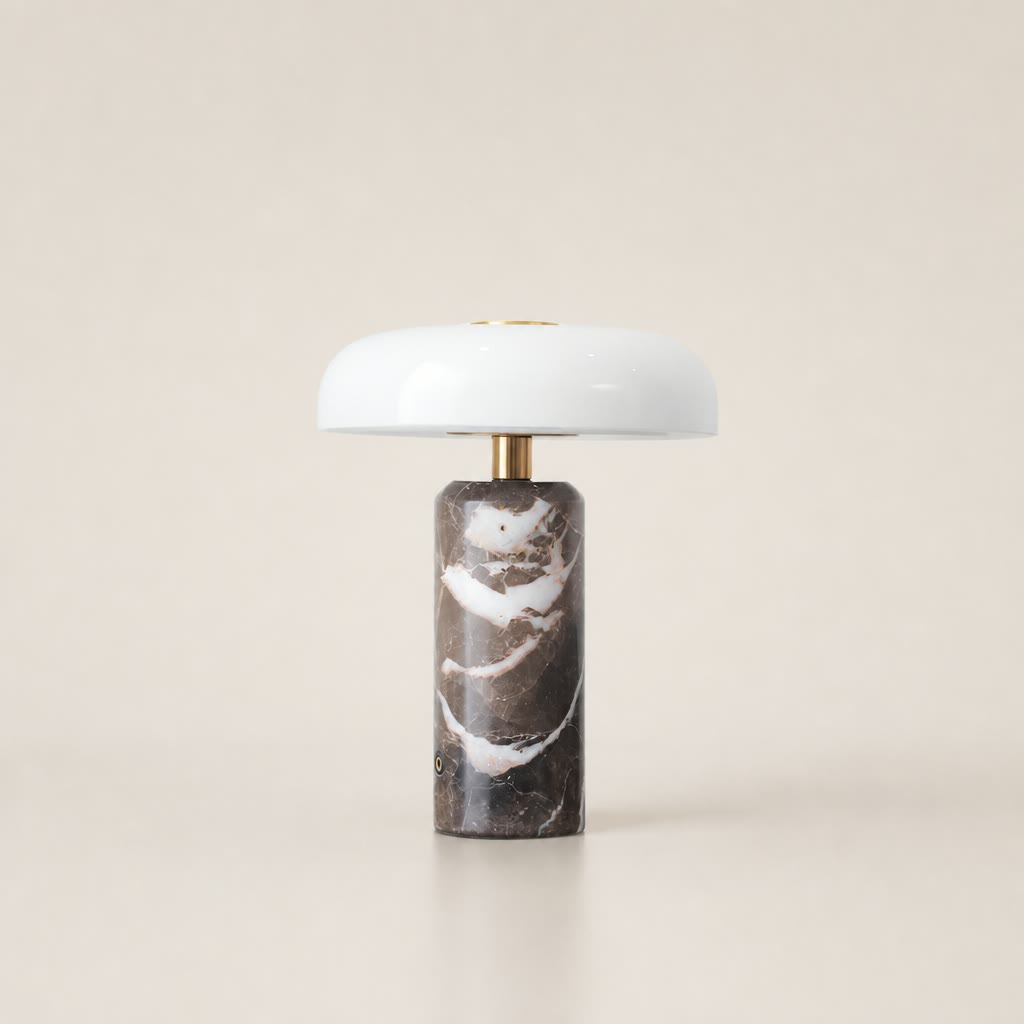 White dome table lamp with brass stem and dark brown marble cylindrical base.