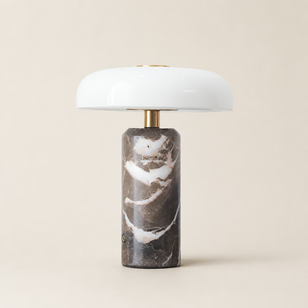 White dome table lamp with brass stem and dark marble cylindrical base.