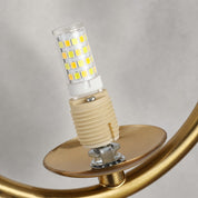 LED corn bulb in a beige socket on an amber glass plate with a gold circular frame.
