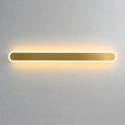 Long rounded wall light with a white glowing rim and warm amber center on a pale gray wall.