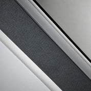 Close-up of a dark textured strip bordered by white and silver trim.