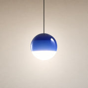 Blue-and-white spherical pendant light hanging from a black cord