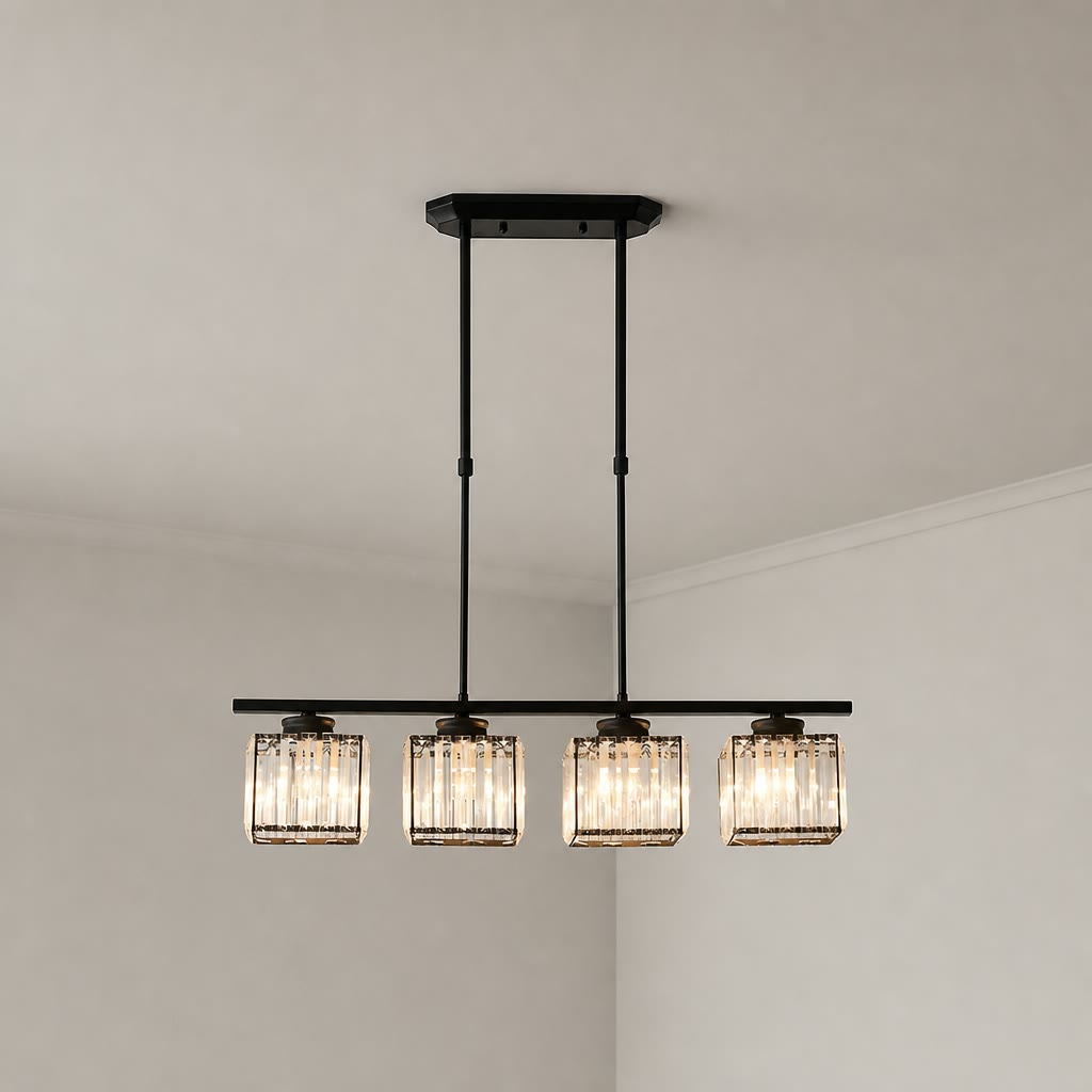 Black four-light linear pendant with glowing ribbed glass shades on a pale corner ceiling.