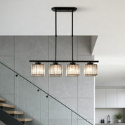 Black linear chandelier with four glowing ribbed glass shades in a modern interior.