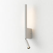 White adjustable wall spotlight with rectangular mount and warm glowing cylindrical head.
