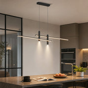 Black dual-bar linear pendant light hanging above a modern kitchen island.