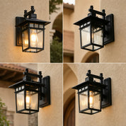 Black outdoor wall lantern with glass panels mounted on a beige stucco wall.