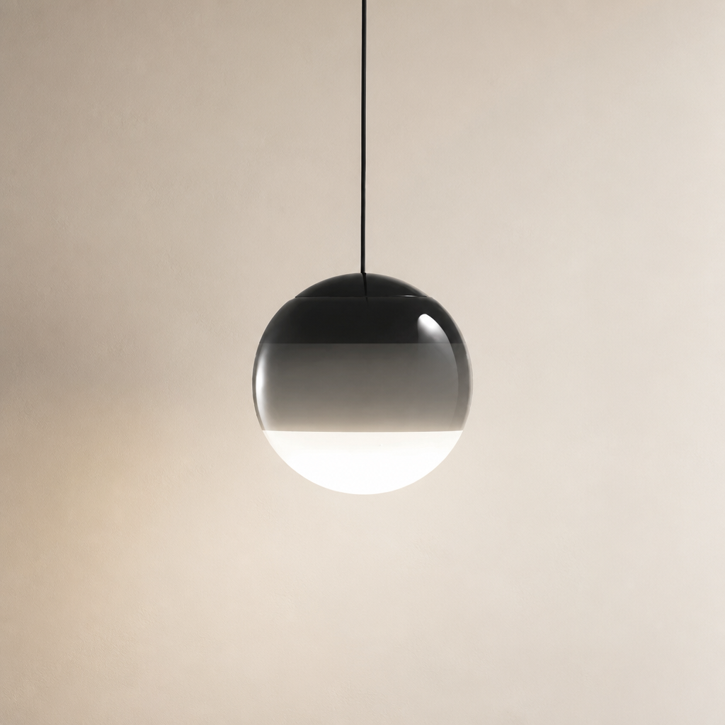 Glossy spherical pendant lamp with a black cord and shaded glass globe.