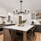 Black six-light chandelier hanging above a white kitchen island
