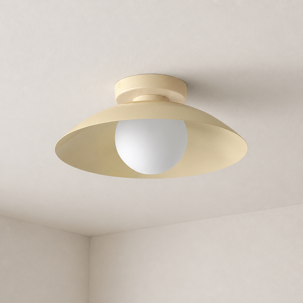 Cream flush-mount ceiling light with a wide saucer shade and frosted white globe.