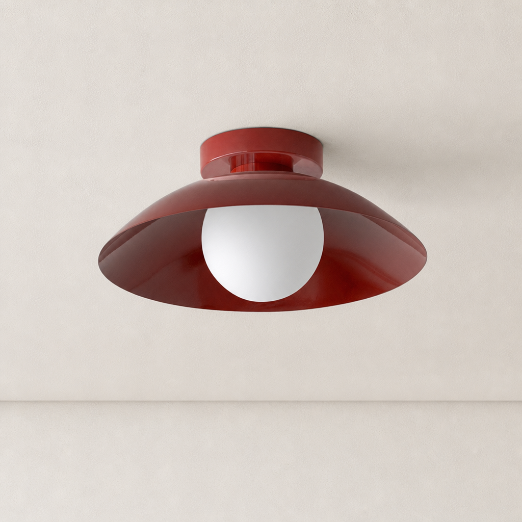 Glossy dark red ceiling light with a wide curved shade and white globe bulb.