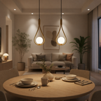Two gold teardrop pendant lights glow above a round dining table in a cozy modern room.