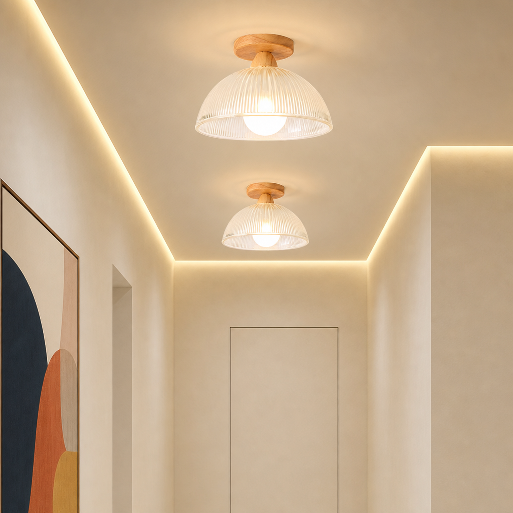 Two warm ceiling lights with white ribbed shades and wood mounts in a modern hallway.