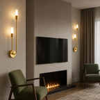 Brass double wall sconces with glowing frosted cylinders in a modern lounge.