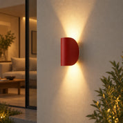 Red wall light beside a doorway